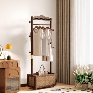 Dark wood garment rack with hanging rails, side pegs, and a woven storage basket