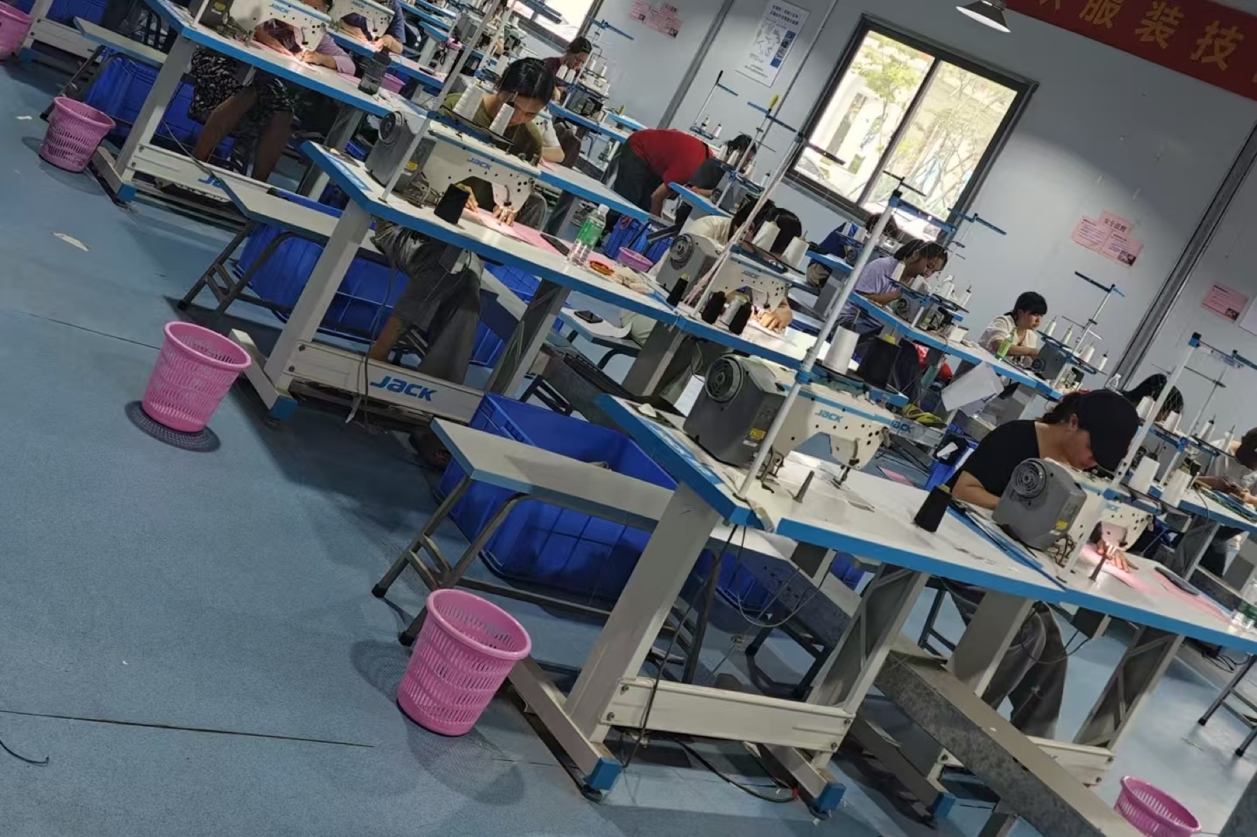 Workers sewing upholstery fabric